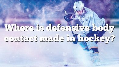 Where is defensive body contact made in hockey?