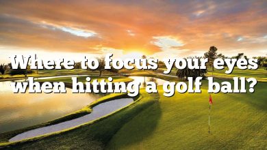 Where to focus your eyes when hitting a golf ball?