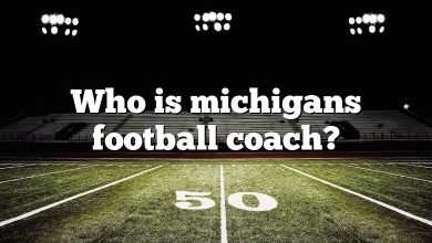 Who is michigans football coach?