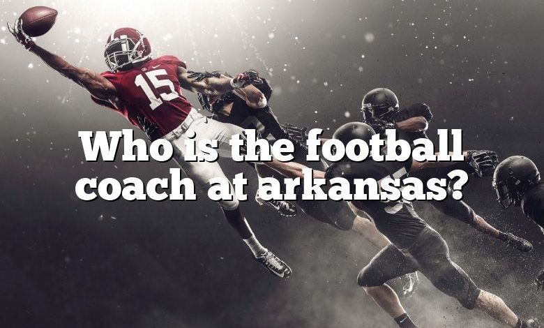 Who is the football coach at arkansas?