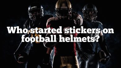 Who started stickers on football helmets?