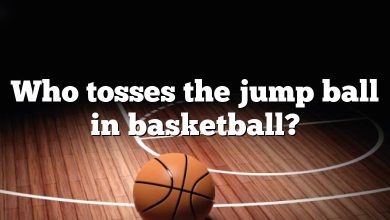 Who tosses the jump ball in basketball?