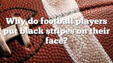 Why do football players put black stripes on their face?