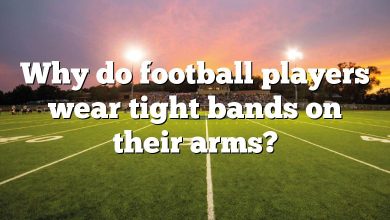 Why do football players wear tight bands on their arms?