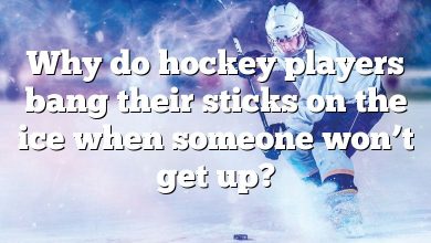 Why do hockey players bang their sticks on the ice when someone won’t get up?