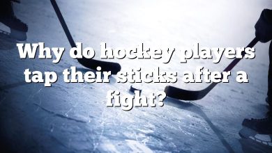 Why do hockey players tap their sticks after a fight?