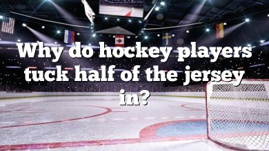Why do hockey players tuck half of the jersey in?