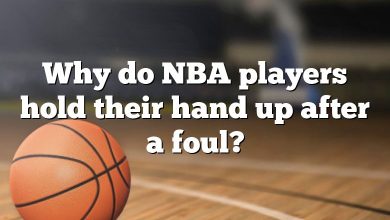 Why do NBA players hold their hand up after a foul?