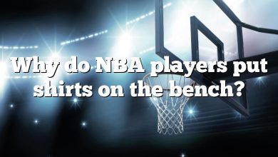 Why do NBA players put shirts on the bench?