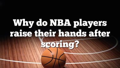 Why do NBA players raise their hands after scoring?