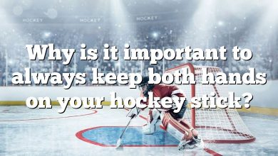 Why is it important to always keep both hands on your hockey stick?