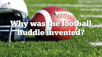 Why was the football huddle invented?