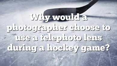 Why would a photographer choose to use a telephoto lens during a hockey game?