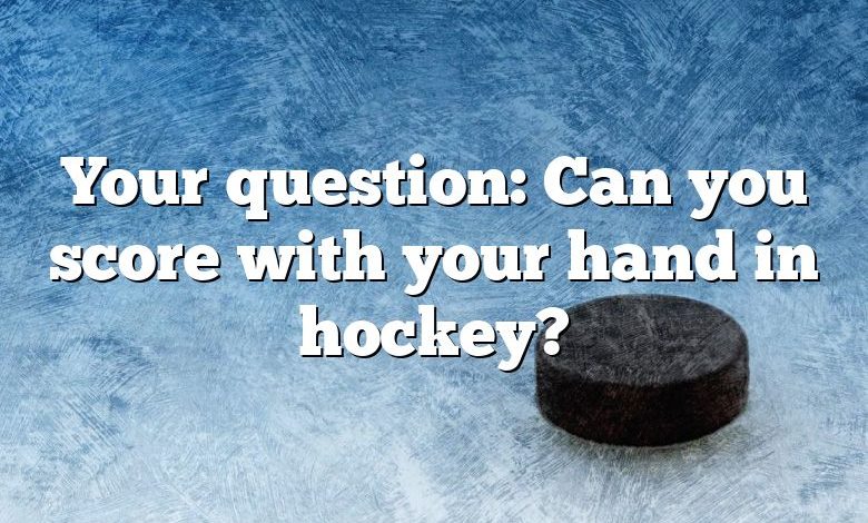 Your question: Can you score with your hand in hockey?